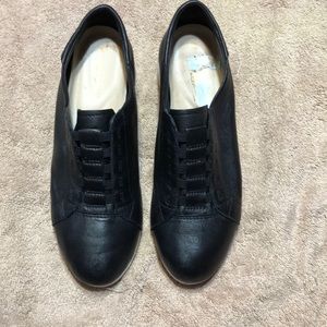 Black Hush Puppy genuine leather loafers.  Size 8